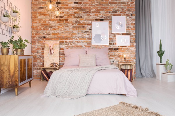 Urban style bedroom with brick wall panelling
