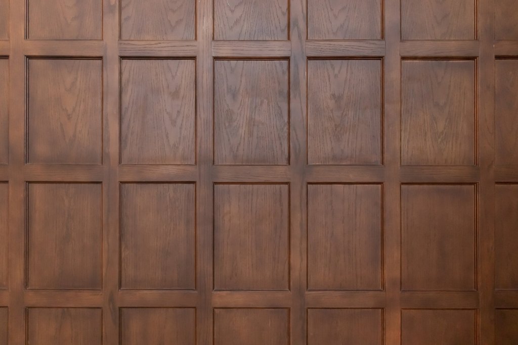 Rich dark brown textured wooden panelled wall in a modern interior