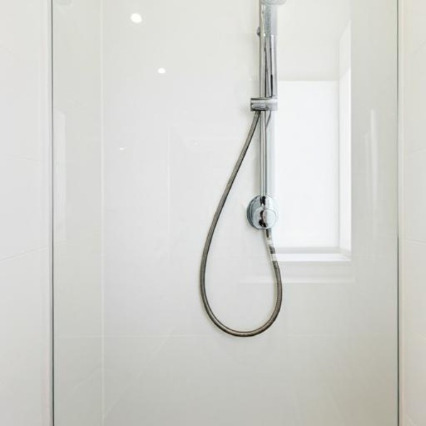 Glass Panels Installed On Shower Wall Instead Of Tiles