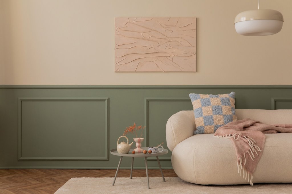 Olive green wainscoting in a modern living room with indoor plants