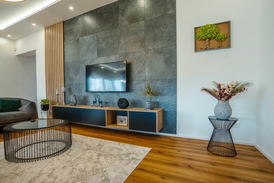 Rustic slat panelling adding a warm, natural element behind the TV.