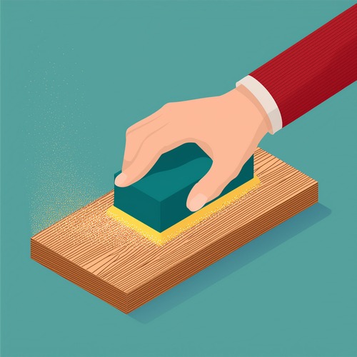 Hand lightly sanding wooden panelling with sandpaper