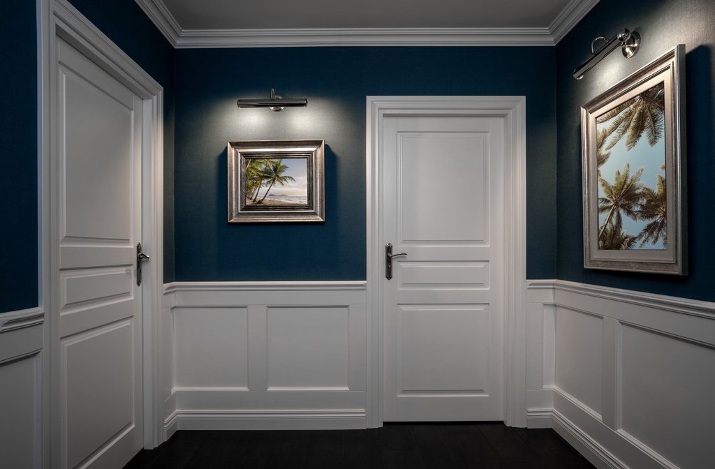 Teal wainscoting in a modern hallway interior design